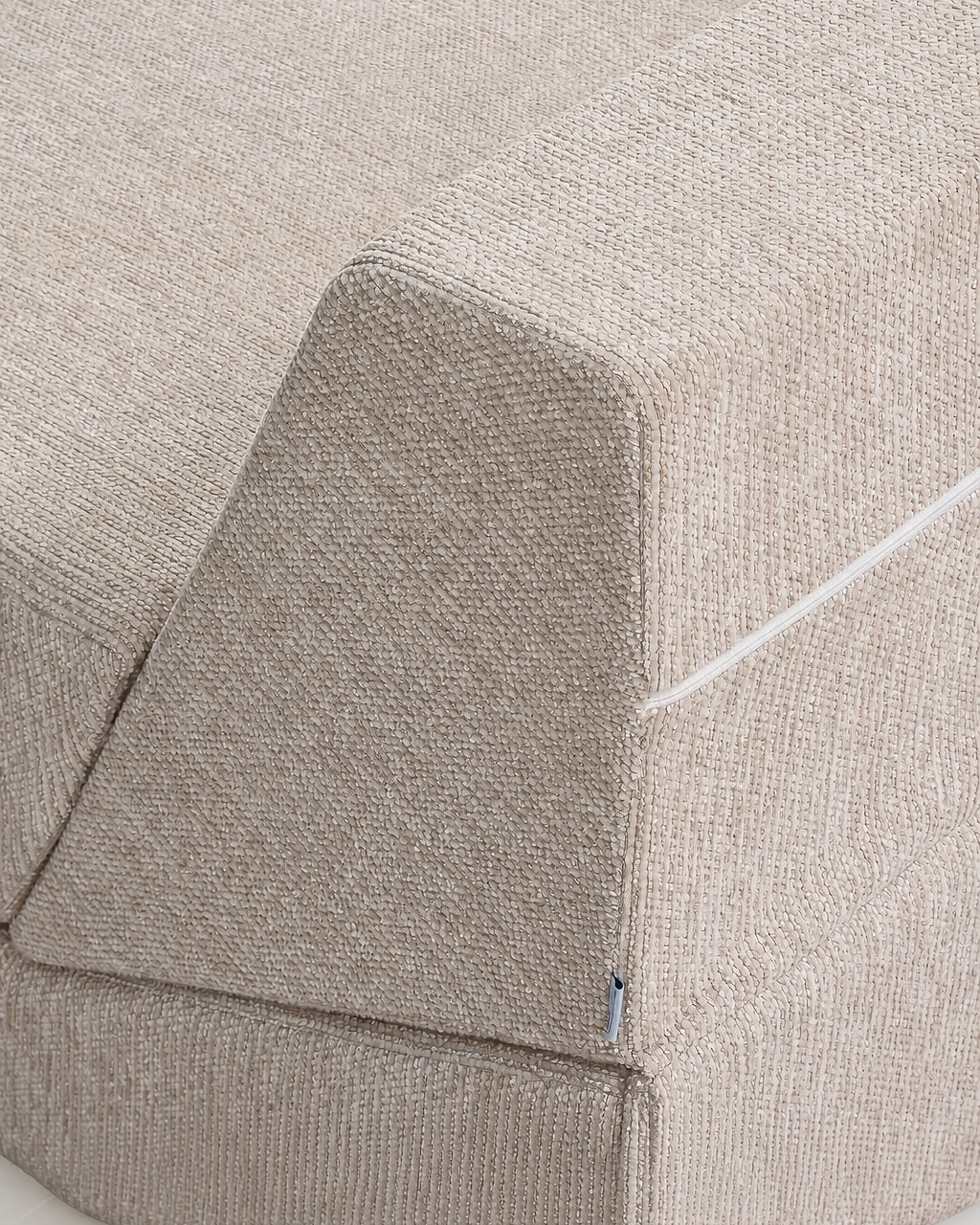 Amy Upholstered Armchair in beige textured fabric, shown vacuum-packed with zipper seam