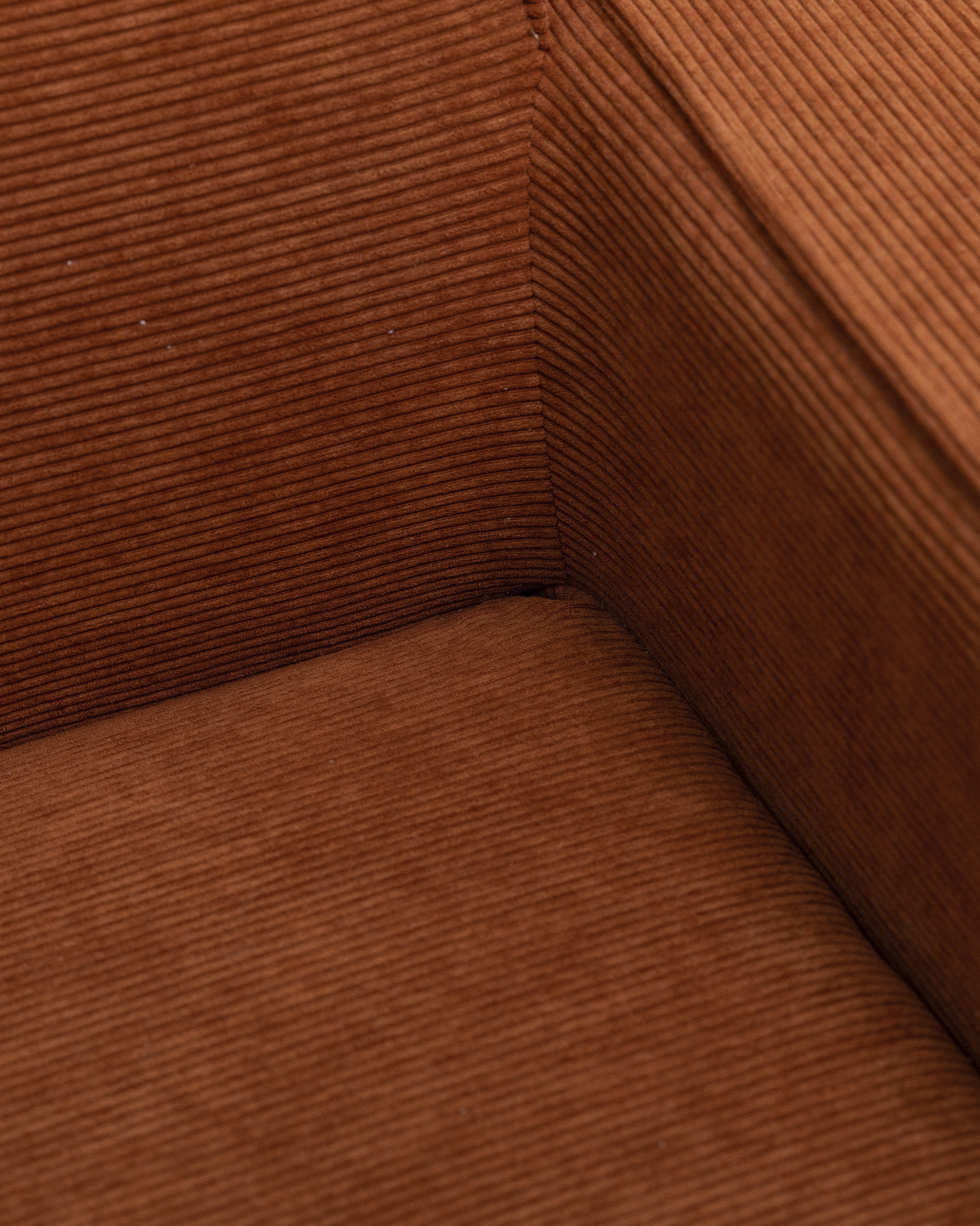 Brel 2-Seater Sofa close-up in orange ribbed fabric