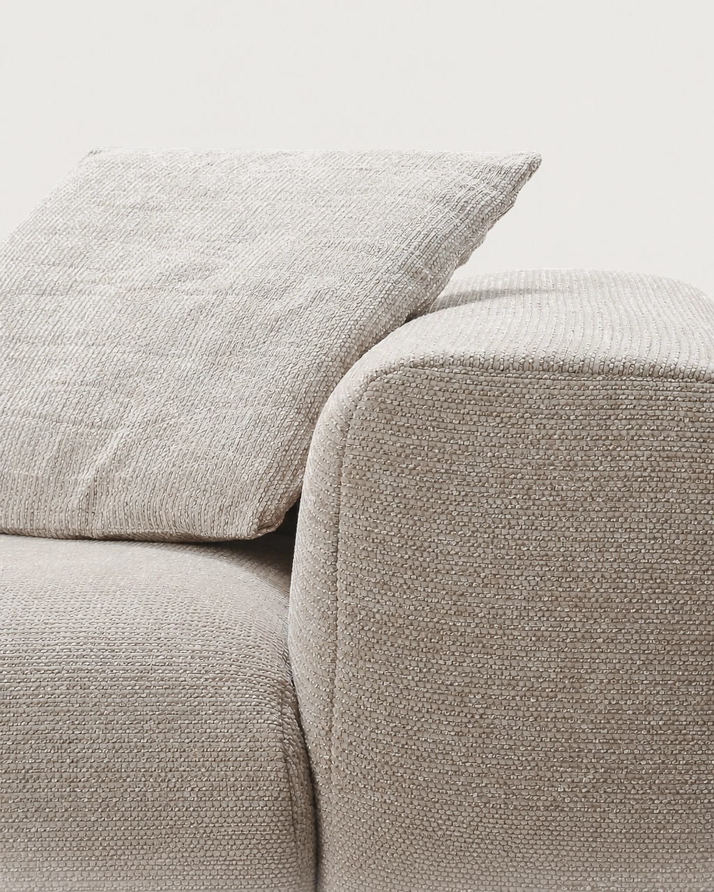 Django 3-Seater Modular Chaise Longue Sofa in textured sand beige fabric, close-up of armrest