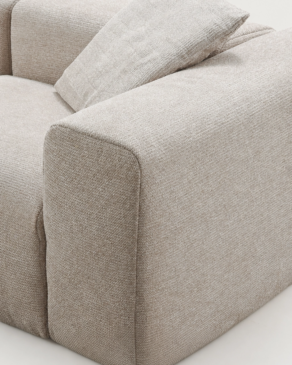 Django 3-Seater Modular Chaise Longue Sofa in textured sand beige fabric, side close-up of armrest