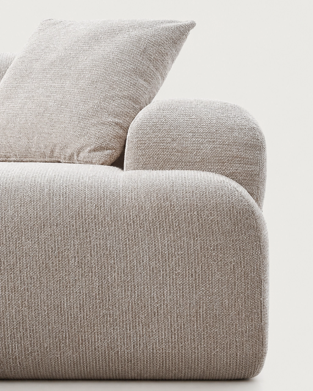 Elvis Modular Sofa close-up with sand beige textured fabric upholstery and rounded armrest