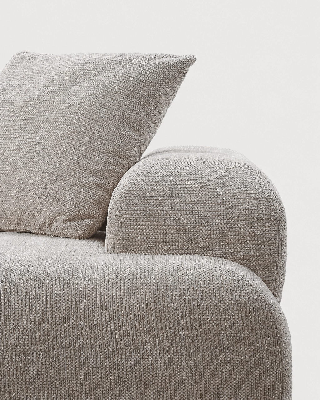 Elvis Modular Sofa close-up with textured sand beige fabric cushion and rounded armrest
