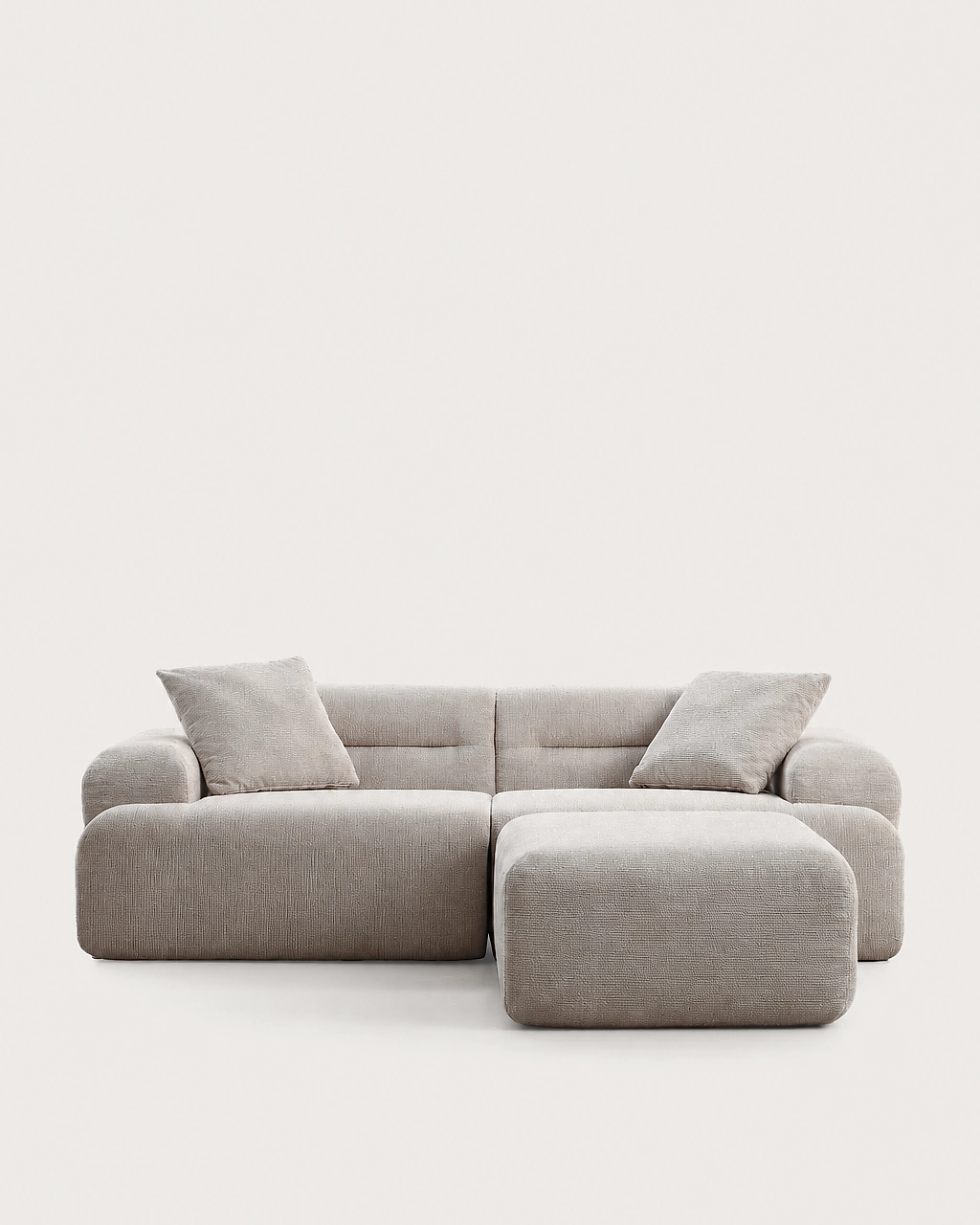 Elvis 3-piece sand beige fabric modular sofa with ottoman and two pillows front view