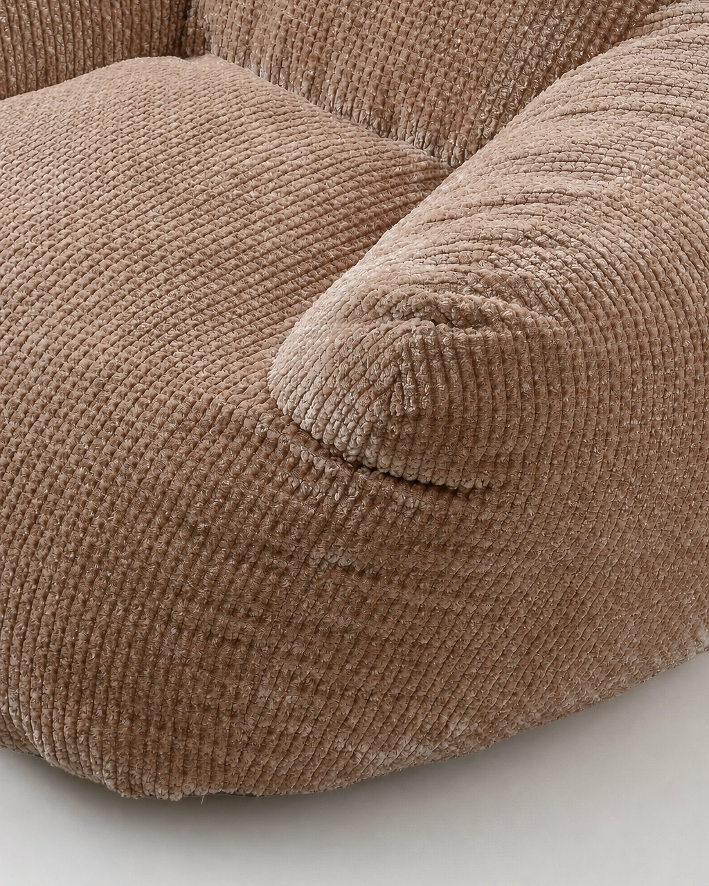 Nina Kids' Upholstered Armchair in taupe fabric, close-up of rounded armrest
