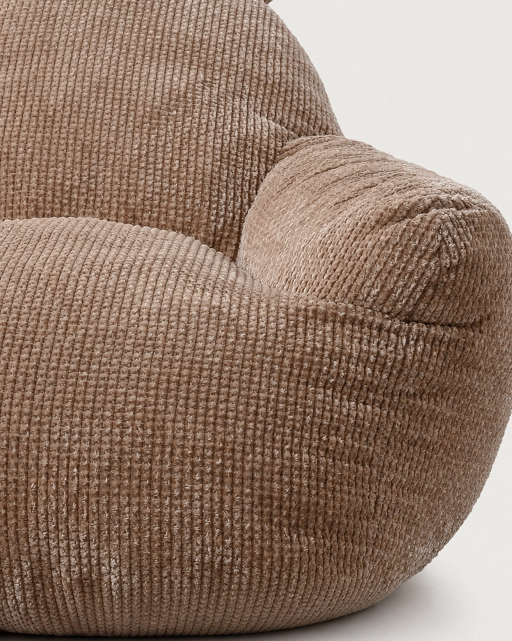 Nina Kids' Upholstered Armchair in textured taupe, close-up of rounded armrest
