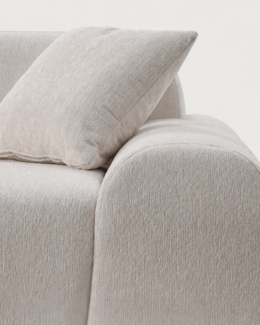 Sinatra Modular Sofa close-up with textured off-white fabric cushion and rounded armrest