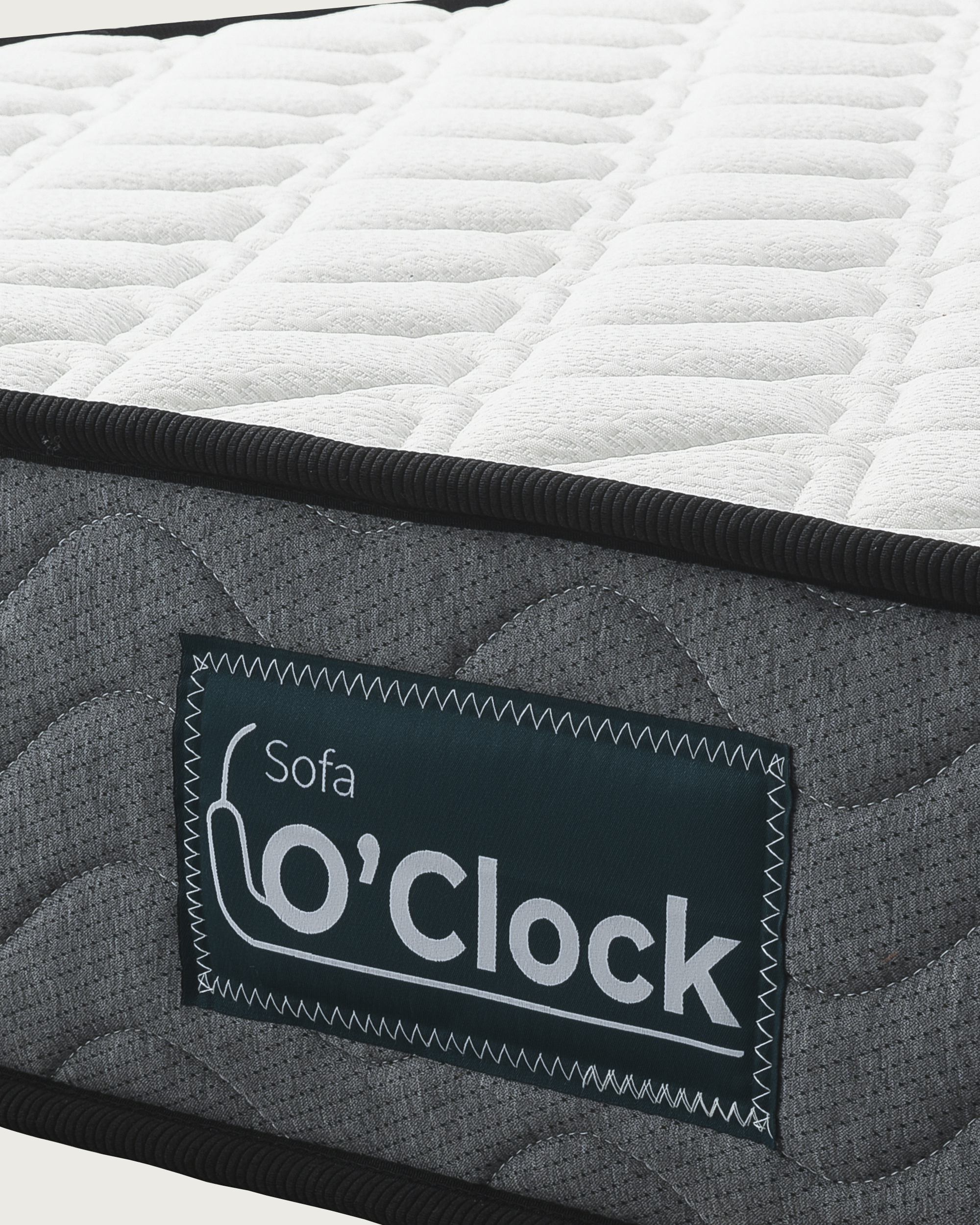 Tina Mattress with white quilted fabric top and gray upholstered sides