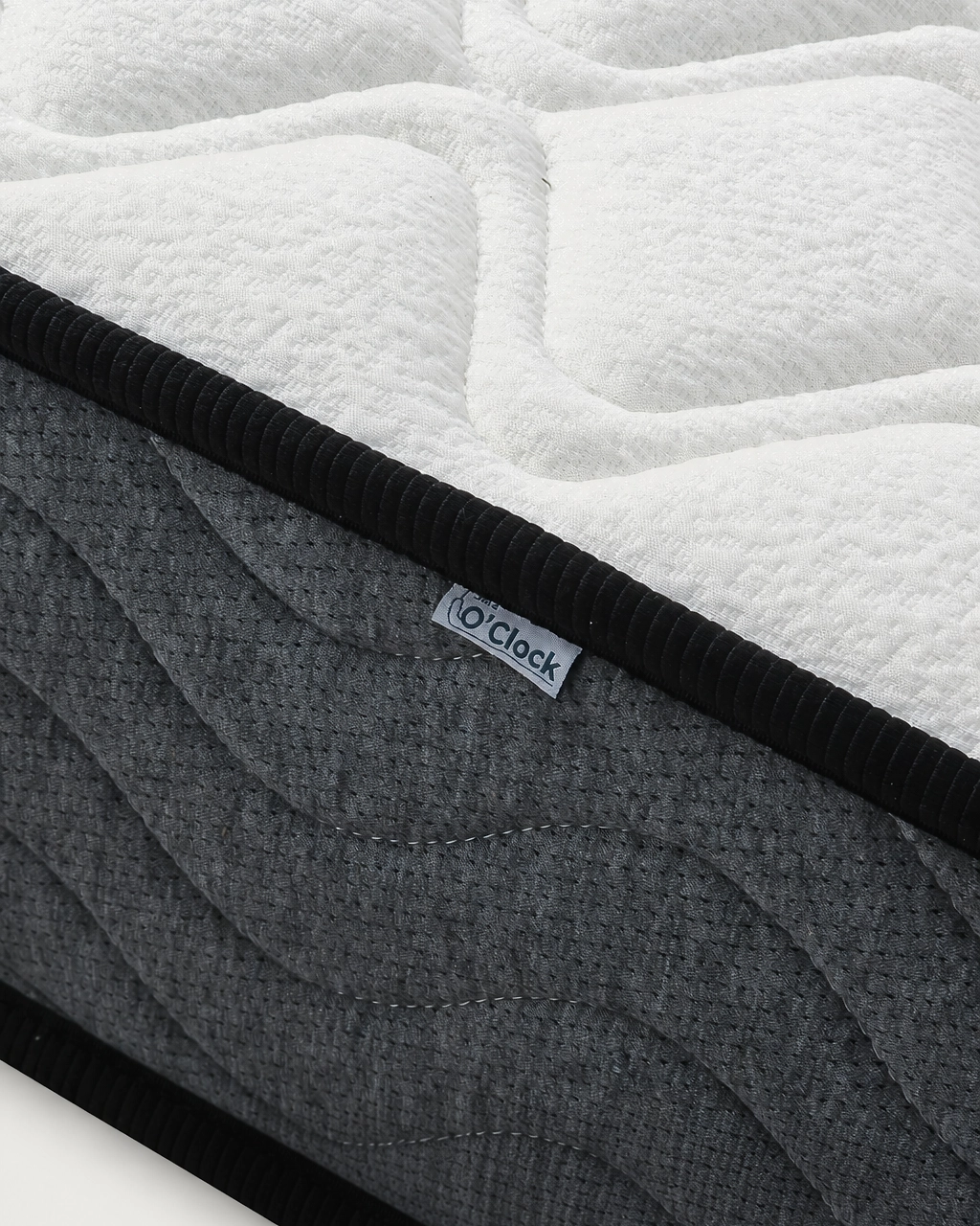 Tina Mattress with quilted white fabric top and dark gray upholstered sides