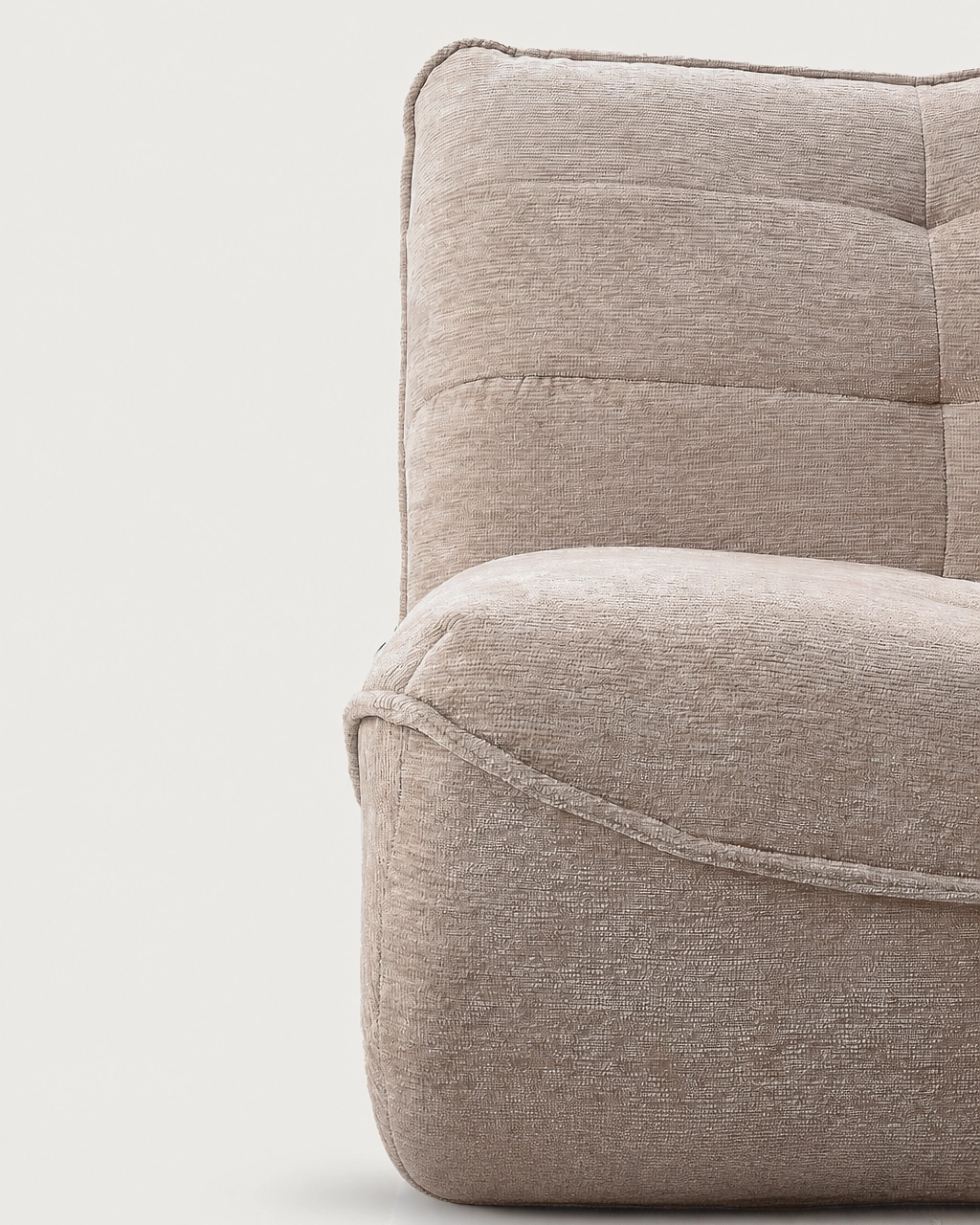 Zeca upholstered armchair in textured sand beige fabric with piped trim