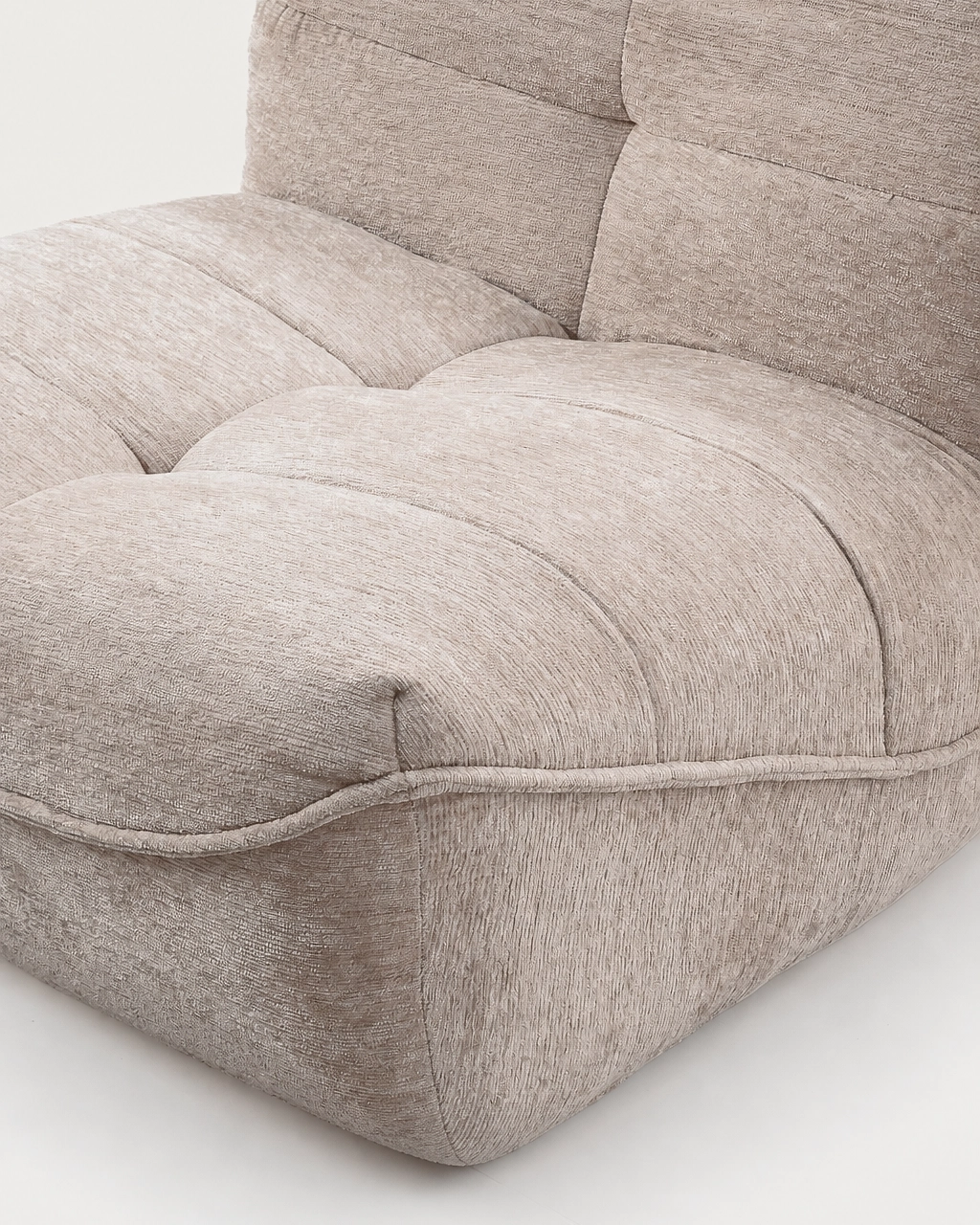 Zeca Upholstered Armchair in sand beige textured fabric with deep cushioned seat and piping